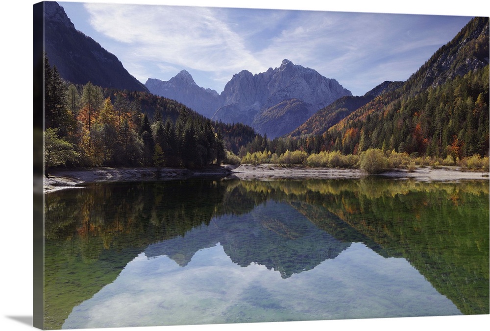 Julian Alps, Peaks of Prisojnik and Razor reflected in pools beside the Velika Pisnca river in autumn.