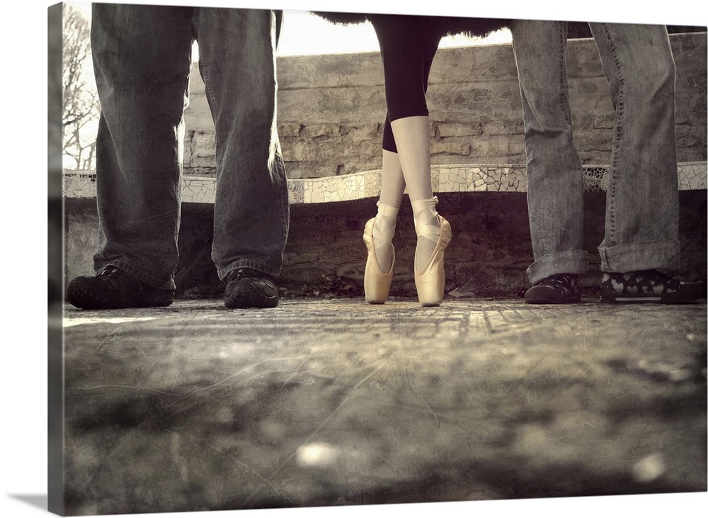 Three people standing at a bus stop, with a ballerina in toe shoes in the middle.