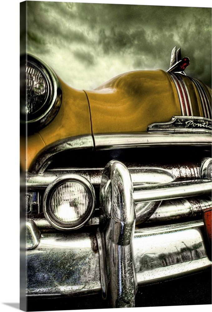 The chrome bumper and yellow bonnet of a classic American car Wall Art