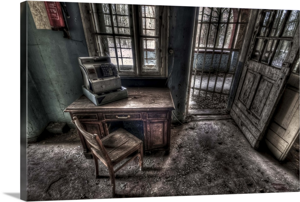 Abandoned lunatic asylum north of Berlin, Germany. Cash till on desk with chair.