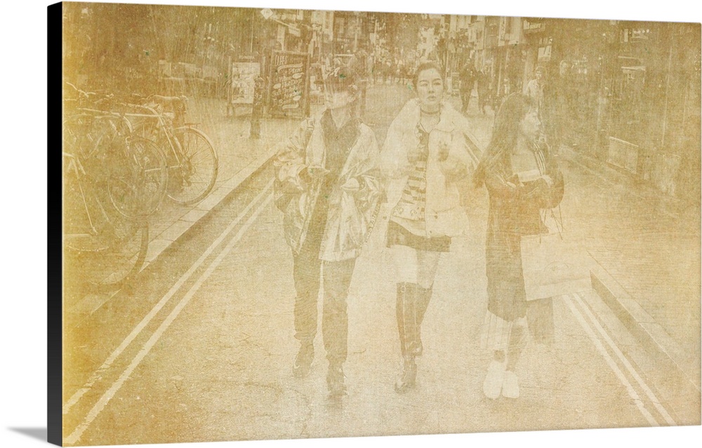 Three asian females walking together in the Brighton Lanes in England.