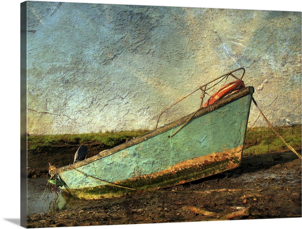 A small boat on mud flats with texture