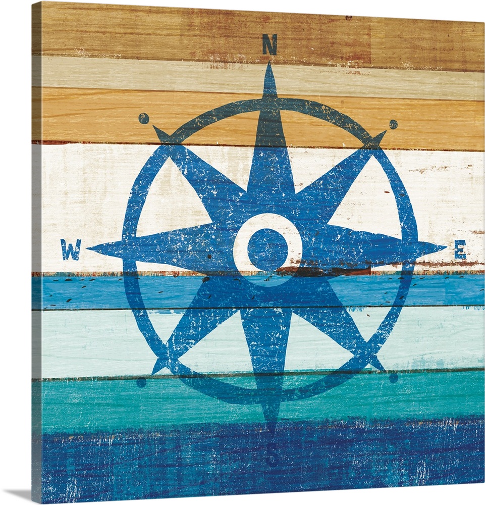 Blue rose compass on a blue and brown painted wood background.