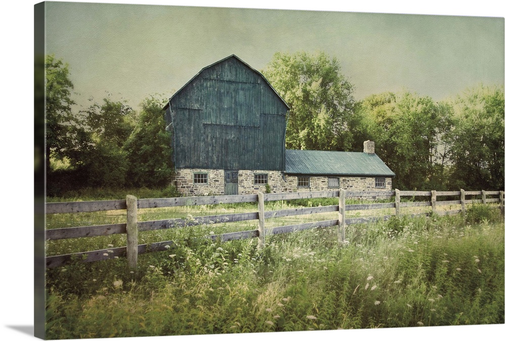 A photograph of a blue barn.
