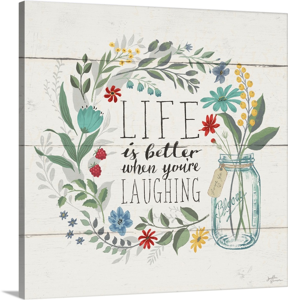 "Life is Better When You're Laughing" written inside a floral wreath on a white wood paneled background.