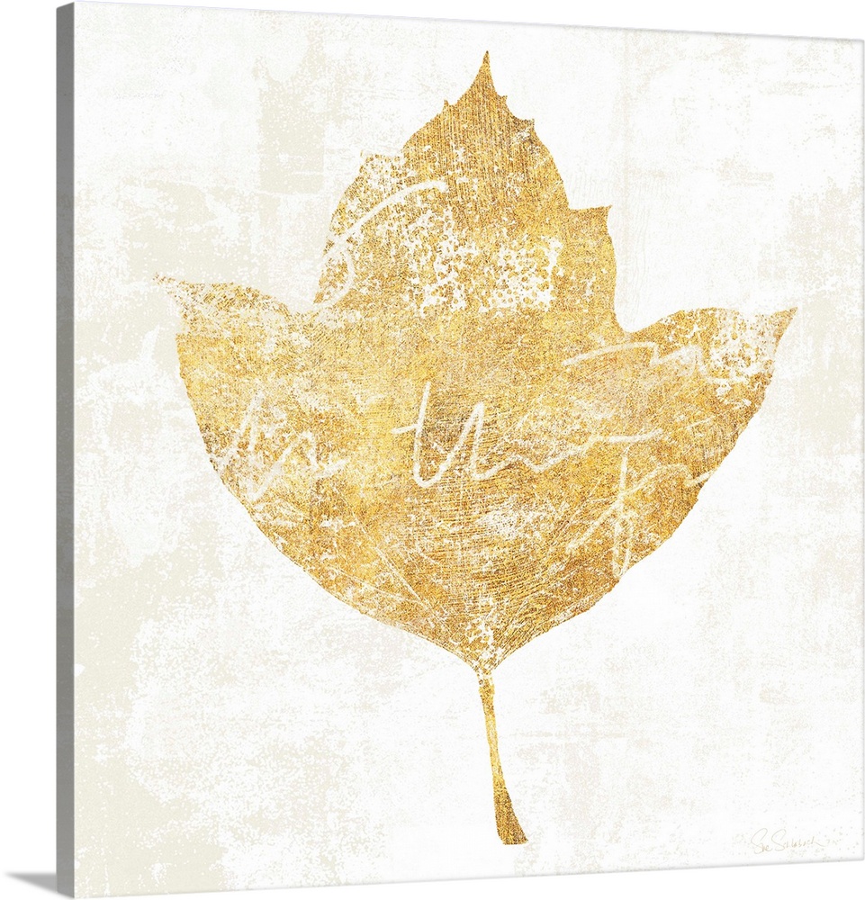 Gold silhouette of a leaf with white writing.