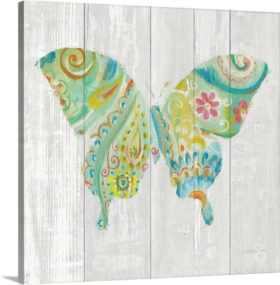 Colorful paisley patterned butterfly against a white washed wood plank background.
