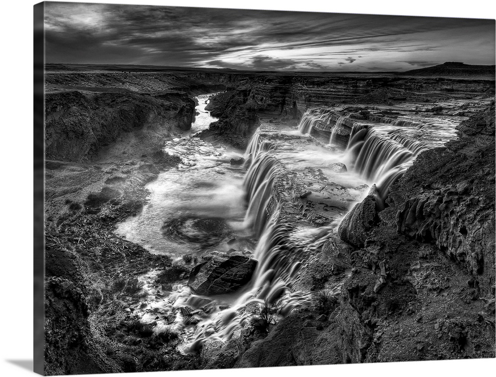 Striking black and white photograph of waterfalls in the desert.