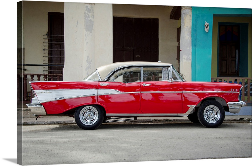 A photograph of a colorful vintage car in Cuba.