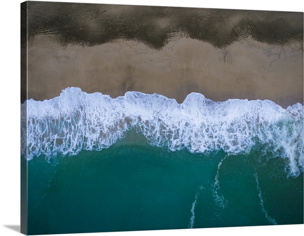 Aerial view of tropical blue ocean water on the Hawaiian coast.