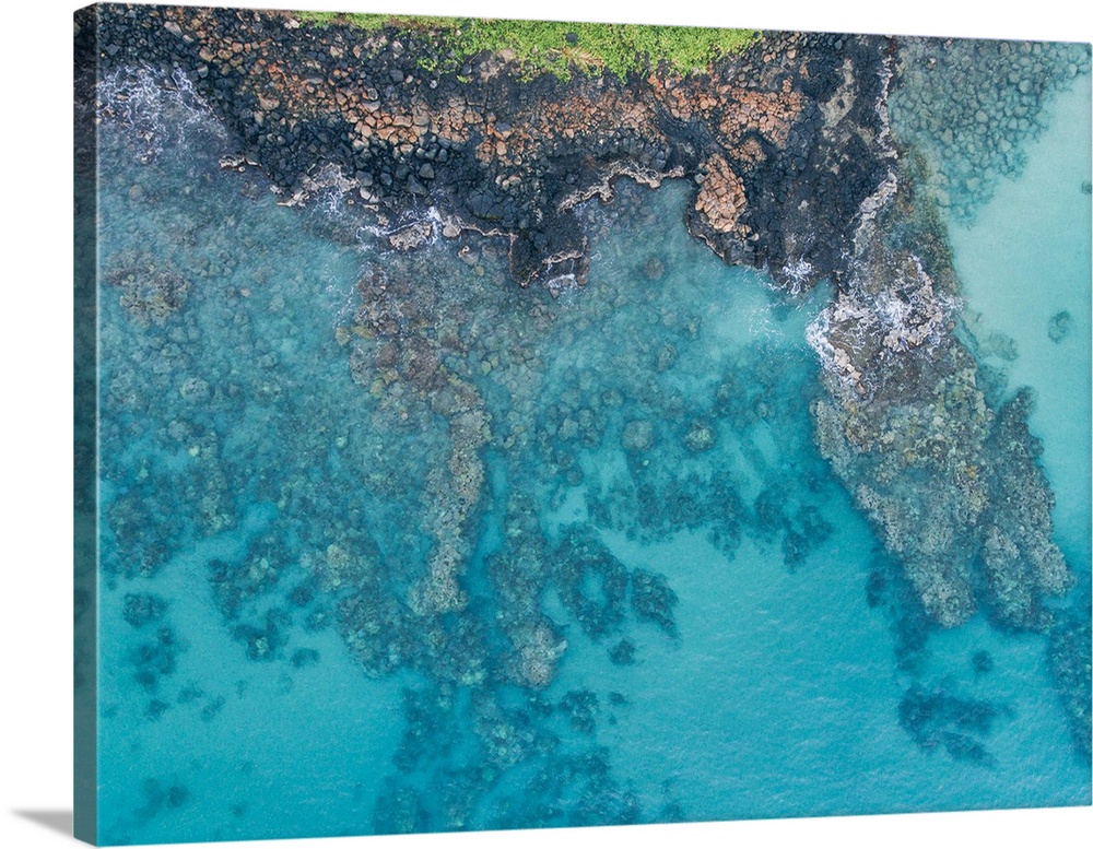 Aerial view of tropical blue ocean water on the Hawaiian coast.