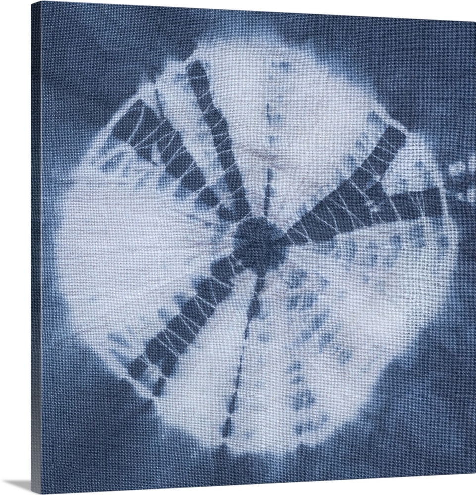 Artistic design of a large tie-dye circle in white on a blue background.