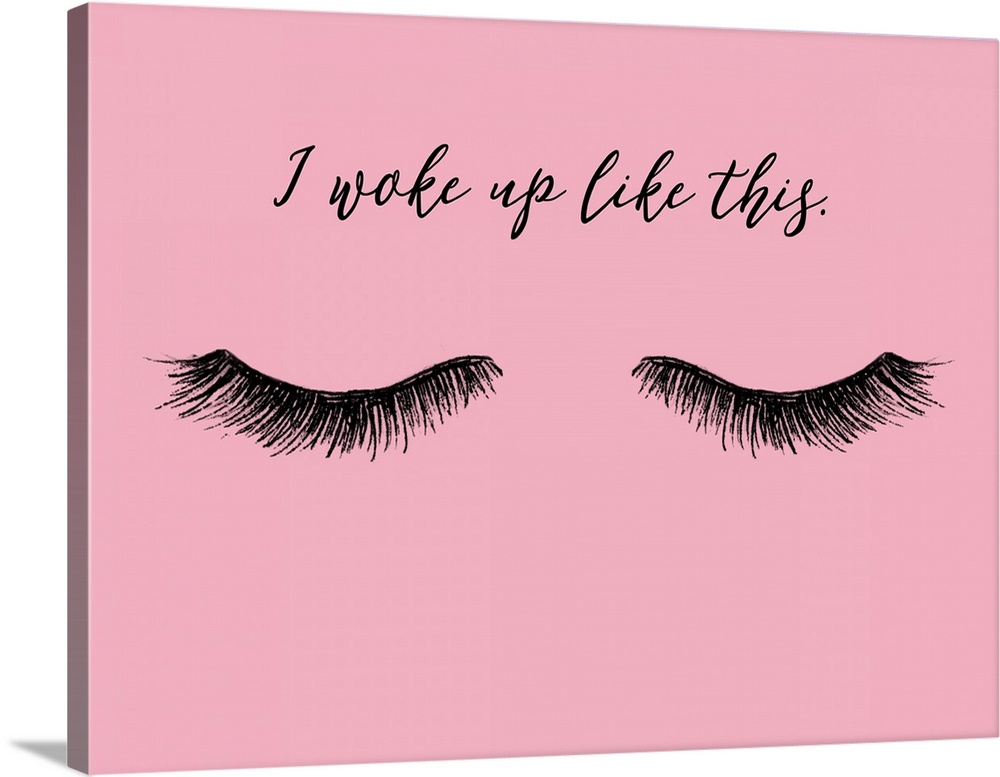 "I Woke Up Like This" with eyelashes in black on a pink background.