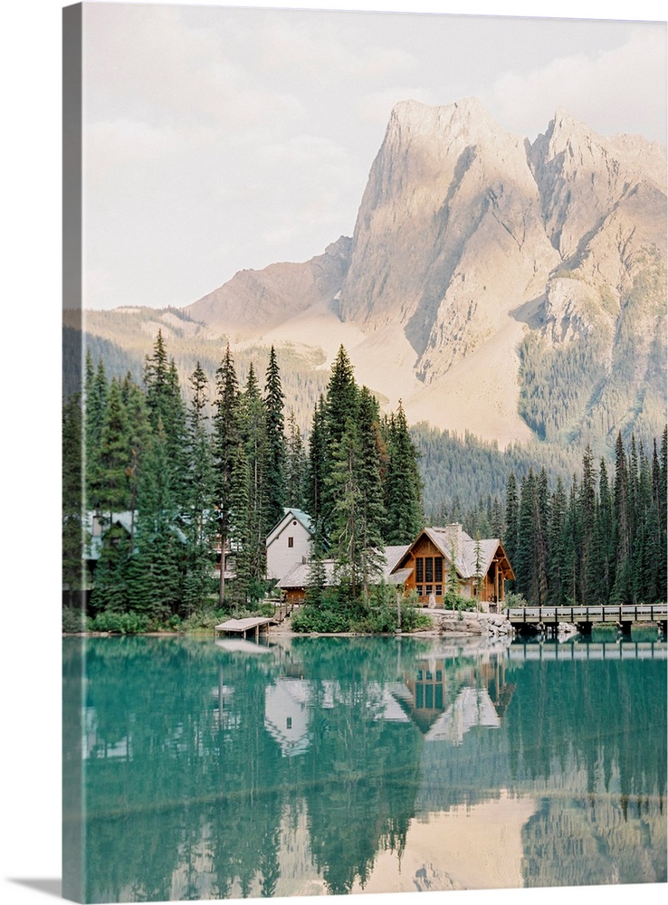 Photograph of Emerald Lake Lodge and surrounding trees reflected in Moraine Lake, Banff, Canada.