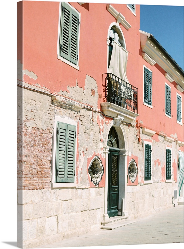 Photograph of ornate doors and windows in old buildings, Burano, Italy.