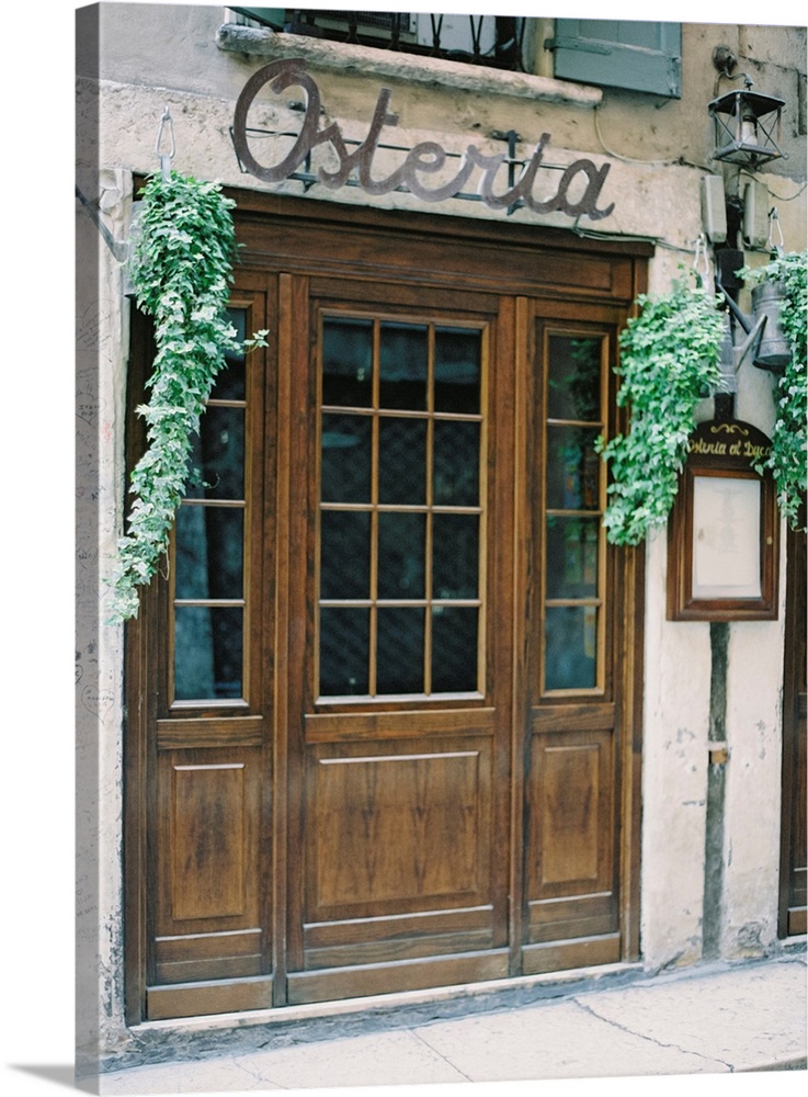 A photograph of the doors of a rustic mediterranean cafe.
