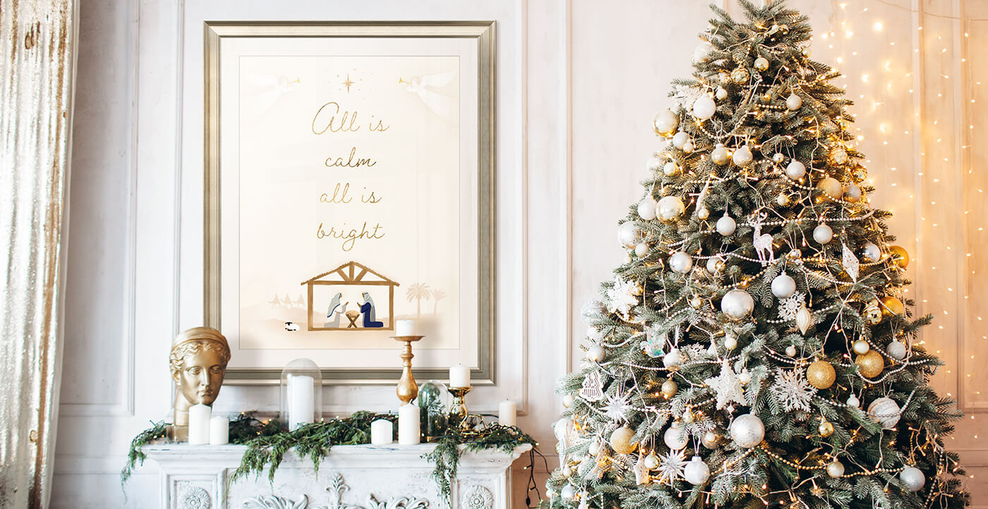 framed print of typographical nativity art over a fireplace in a holiday living room