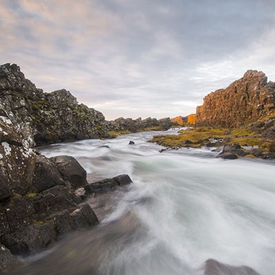 photograph of a river running between rocks